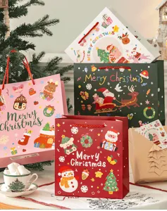 Cute Christmas paper gift bags set with festive cartoon designs and handles for holiday presents.