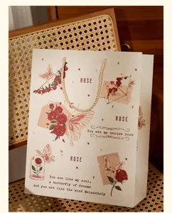 Vintage rose and butterfly paper gift bag detail, elegant packaging for holiday presents.