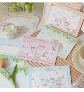 Detailed close-up view of aesthetic cute pastel stationery set with lovely rabbit cards.