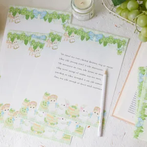 Cute rabbit stationery writing paper set with green grid and envelope for letter writing.
