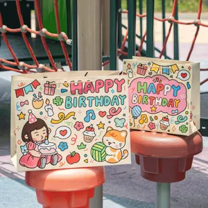 Cute cartoon birthday gift bags with handles, perfect for party favors and presents.
