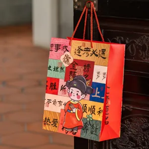 Gift paper bag for exam success graduation celebration, festive red tote bag with blessing words.