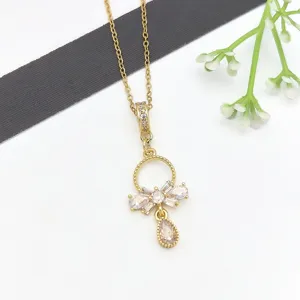 Squisita collana con ciondolo in zircone placcato oro con elegante fiocco e goccia per donna.