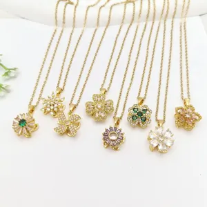 Collana in acciaio inossidabile dorato con ciondoli floreali in zircone brillante, design elegante.