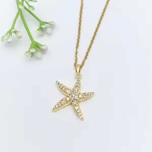 Collana con ciondolo a stella Marina in zircone cubico dorato, stile oceano elegante.