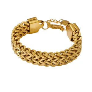 Detail shot of a chunky gold titanium steel braided chain bracelet with secure clasp.