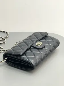 Black quilted leather chain bag detail shot featuring gold hardware and classic flap design.