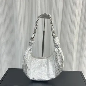 Silver metallic leather dumpling bag detail, showcasing unique crinkled texture and chain handle.