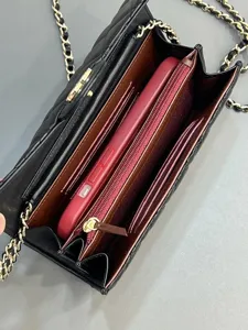 Detailed view of black quilted chain crossbody bag interior capacity and card slots.