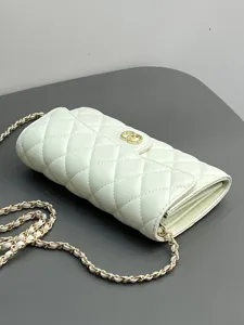 White quilted leather crossbody chain bag, stylish phone purse with gold hardware details.