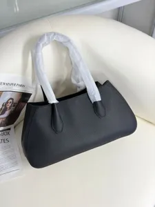 Black genuine leather tote bag for women, stylish minimalist shoulder handbag with top handles.