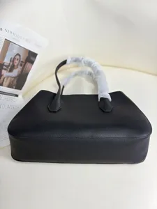 Black genuine leather tote bag for women, stylish minimalist shoulder bag daily use.