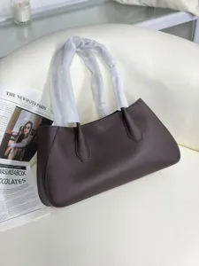 Elegant genuine leather shoulder bag for women, stylish brown tote baguette bag with top handle.