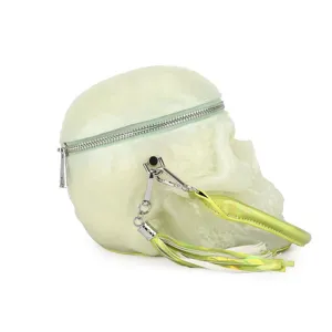 Gothic punk style luminous skull shaped handbag with metal zipper and tassel detail for women.