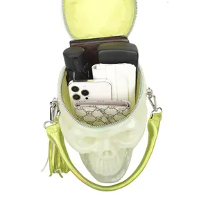 Punk style translucent lime green skull handbag detail shot showing interior capacity.