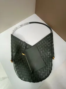 Dark green woven leather shoulder bag with small pouch, soft large capacity fashion tote design.
