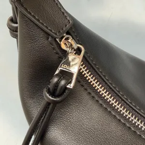 Black leather shoulder bag detail zipper hardware classic luxury style premium daily