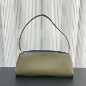Elegant olive green leather baguette shoulder bag for women, chic underarm purse with blue lining.