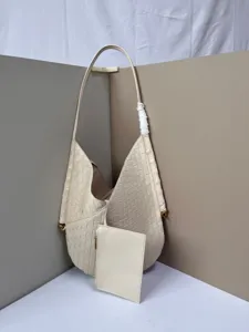 Woven leather hobo shoulder bag with small pouch detail, soft cream white large capacity tote.