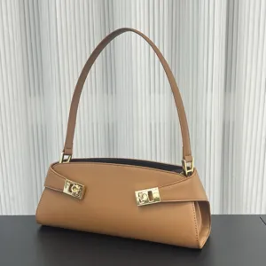 Brown leather shoulder bag detail with elegant metal buckle, premium fashion baguette bag for women.