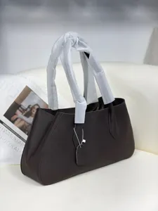 Dark brown pebbled leather tote bag for women, stylish minimalist shoulder baguette handbag.