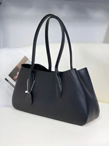 Black leather shoulder tote bag, premium cowhide baguette bag with dual slim handles and clean design.