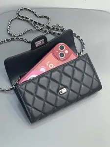 Black quilted leather chain crossbody bag, elegant fashion mobile phone purse for women.