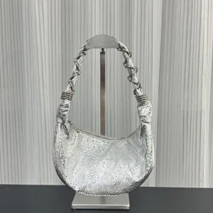 Silver metallic genuine leather hobo dumpling shoulder bag with stylish chain strap.