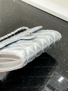 Silver quilted leather chain crossbody bag, stylish women phone bag detail view.