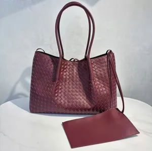 Burgundy woven leather tote bag detail, luxury intrecciato design shoulder shopping bag