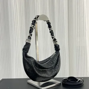 Black genuine leather crescent dumpling bag with metallic chain strap and casual hobo design.