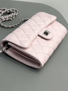 Pink quilted leather chain crossbody bag, elegant flap design with metallic turn-lock.