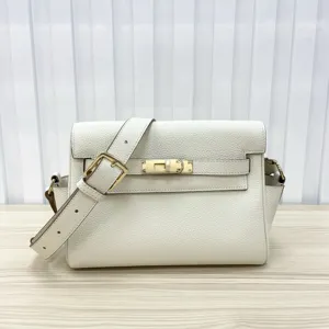 White genuine leather Kelly messenger shoulder bag with metal lock and adjustable strap.