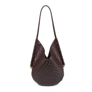 Detailed view of the dark brown woven leather shoulder bag, showcasing fine craft.