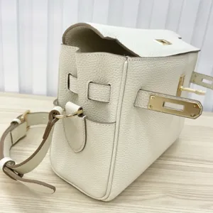 White leather shoulder crossbody bag with classic lock flap design for women fashion daily use.