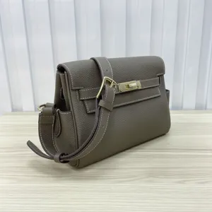 Genuine leather women messenger bag with metal lock closure and fine taupe texture view.