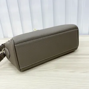 Grey genuine leather messenger bag with chic gold lock closure for women daily use