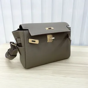 Classic leather shoulder bag with metal turn lock design, elegant women messenger bag.