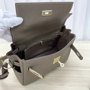 Genuine leather Kelly messenger bag for women, stylish shoulder crossbody bag with metal lock.