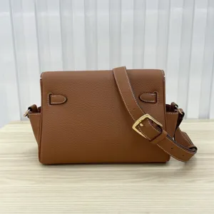 Brown genuine leather women shoulder messenger bag with metal buckle and adjustable strap.