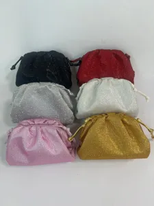 Detailed view of luxury rhinestone pleated cloud evening bag, sparkling crystal clutch purse.