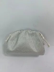 Silver rhinestone pouch bag sparkling crystal clutch evening bag with white leather drawstring.