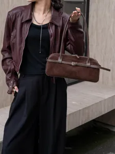 Retro suede boston bag detail view, genuine leather shoulder handbag for women in autumn.