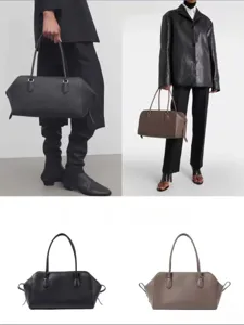 Minimalist genuine leather EW bowling bag, large capacity commute tote bag for women.