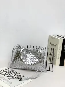 Silver woven leather pouch bag detail view showing artisanal intrecciato texture and design.