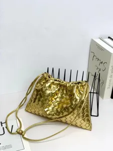 Gold woven leather shoulder crossbody bag featuring a chic drawstring pouch cloud design.
