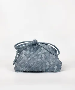 Woven cloud clutch bag with stylish knotted handle and premium braided texture design.