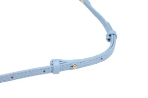 Close-up detail of light blue leather bag shoulder strap with metal adjustable buckle.