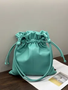 Mint green leather drawstring pouch bag, stylish minimalist cloud shoulder bag for women.