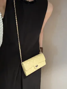 Yellow quilted chain crossbody bag for women, classic leather shoulder phone bag and chic handbag.